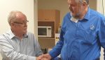 Arthur Chawner shakes hand with Link Vision CEO Terry Oneill